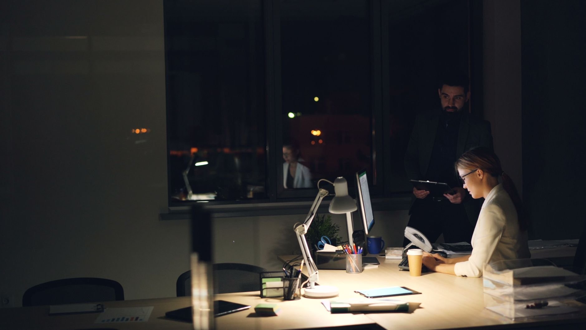 Two professionals working focused in an office environment